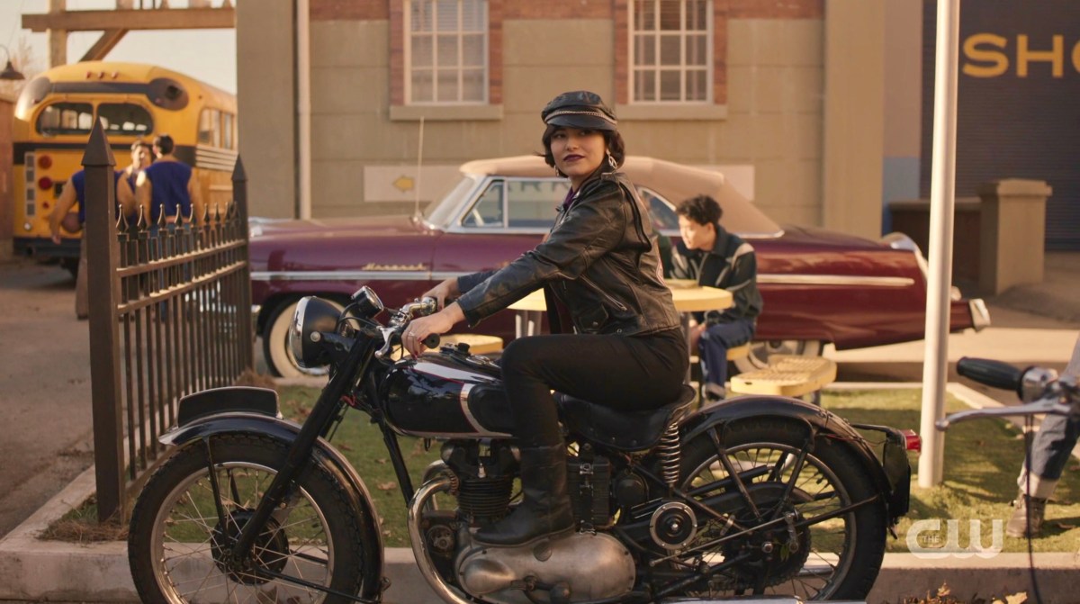Lizzo on Riverdale is a biker dyke with a leather cap, leather jacket, and a motorcycle