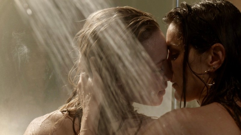 Carina and Maya make out in the shower on Station 19, both of their hair dripping wet.