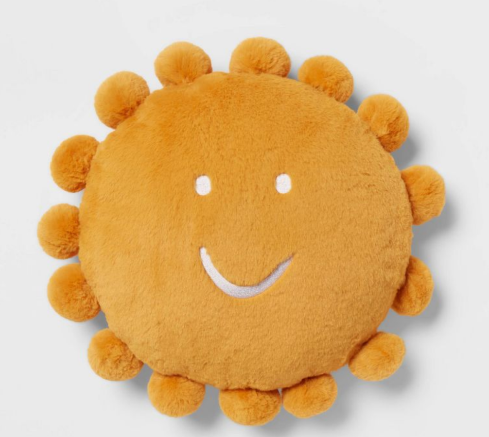 a sun-shaped throw pillow
