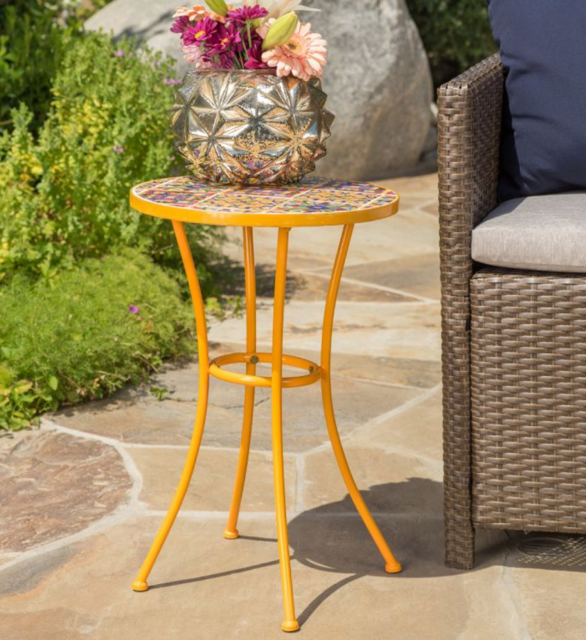 a ceramic tile side table in yellow, orange, and blue