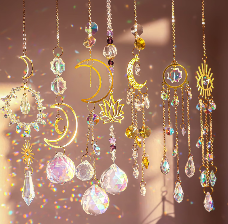 crystal suncatchers with moon, sun, and star shapes
