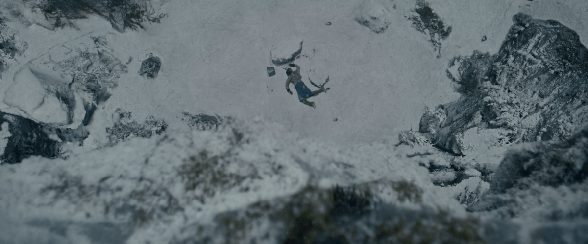 a body sprawled in the snow from above