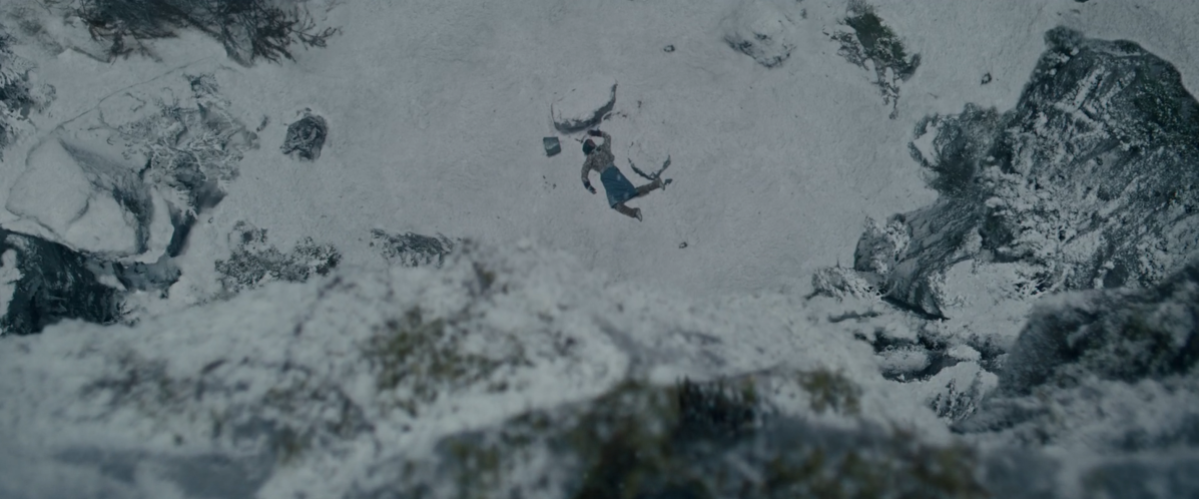 a body sprawled in the snow from above