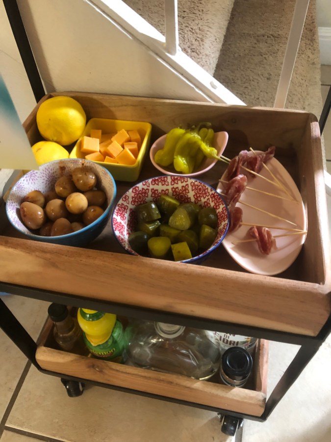 lemons, cheese cubes, pickles, marinaded quail eggs, skewered salami, pepperoncini