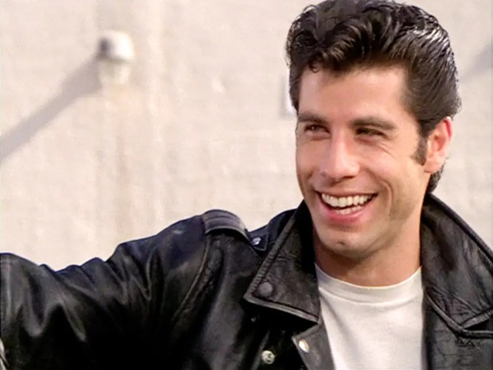 Danny Zuko in leather jacket and white t-shirt in "Grease"