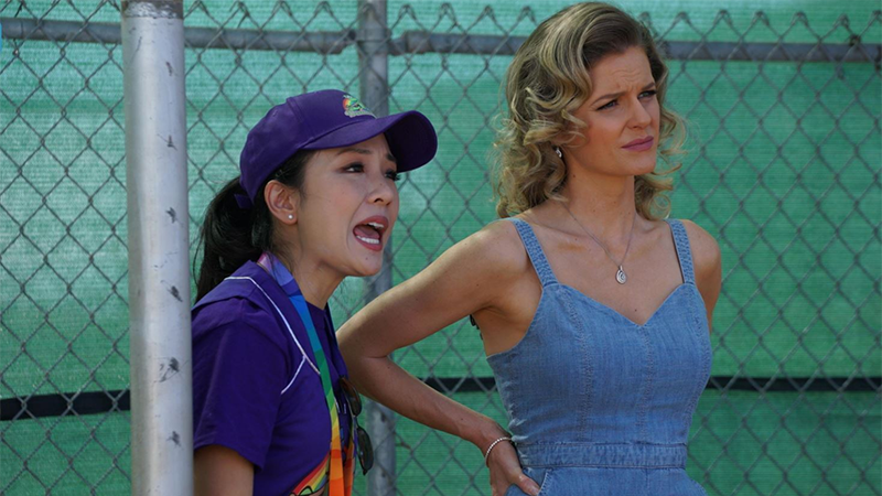 Honey and Jessica Huang stand in a baseball dugout on Fresh Off the Boat
