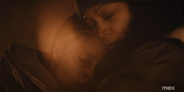 Jodie Foster in True Detective, cuddled close to another woman in the snow.