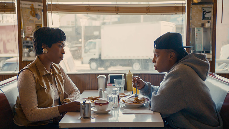 Angela Bassett and Lena Waithe sit across the table from each other during the Thanksgiving episode of Master of None