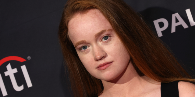 Liv Hewson on a red carpet in close up