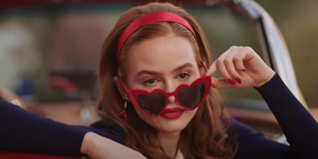 Cheryl Blossom wearing heart shaped sunglasses riding in a convertible on Riverdale