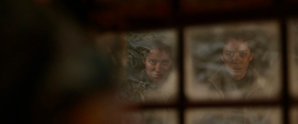 Other Tai smiles at Tai in a snowy windowpane in Yellowjackets 208