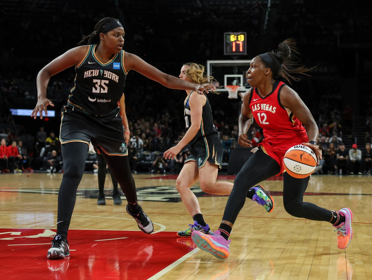 LAS VEGAS, NEVADA - MAY 13: Chelsea Gray #12 of the Las Vegas Aces drives against Jonquel Jones #35 of the New York Liberty in the third quarter of their preseason game at Michelob ULTRA Arena on May 13, 2023 in Las Vegas, Nevada. The Aces defeated the Liberty 