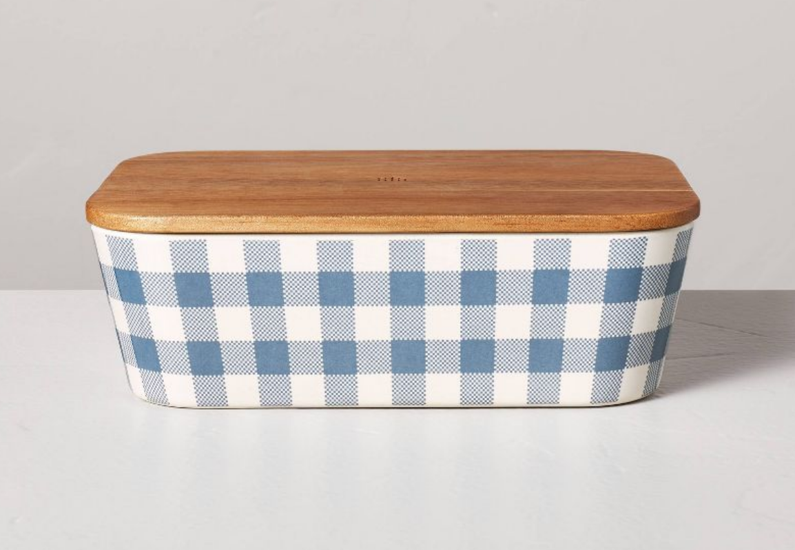 a blue and white checked food storage box with a bamboo lid