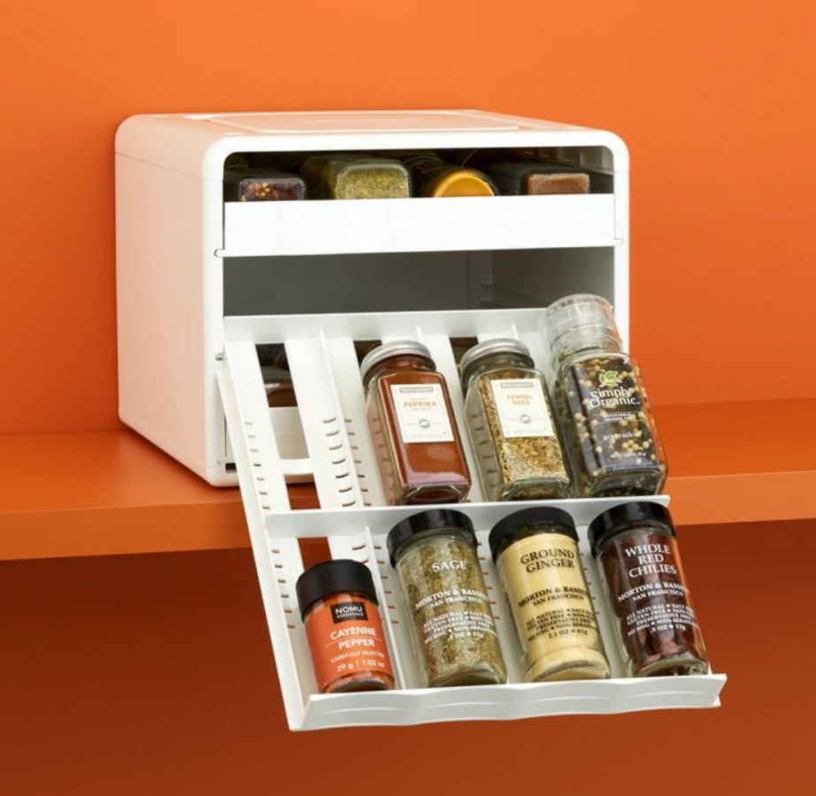 a white spice organizer with three shelves