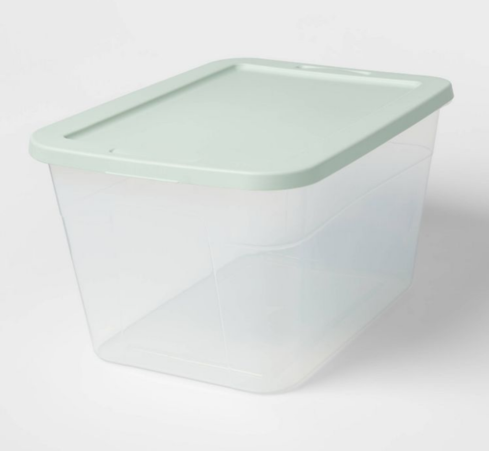 a large plastic box with green lid