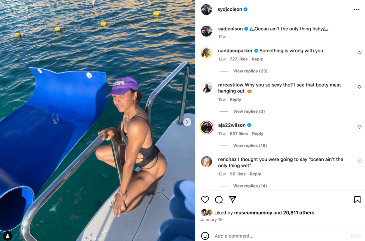 Sydney Colson is in a bathing suit and baseball cap on her instagram. The caption reads: "The ocean ain't the only thing that's fishy" and many different WNBA players are joking with Syd in the comments below.