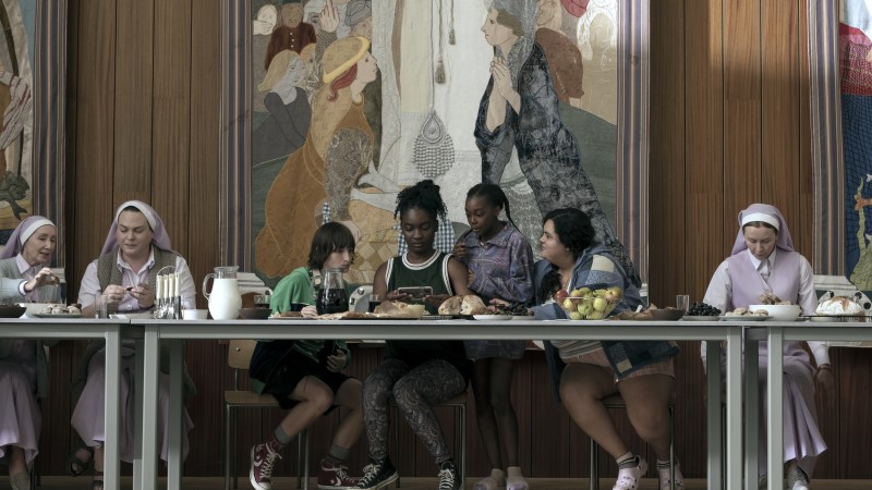 Eve and her groupies sit around a table not unlike the famous painting of the Last Supper