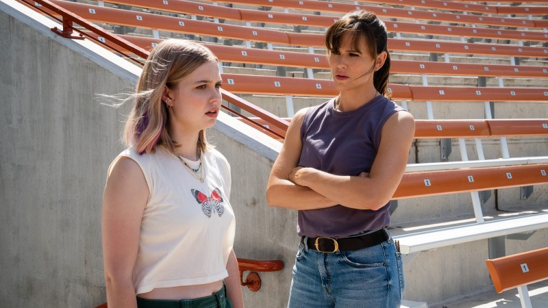 Hannah and Bailey stand in a stadium