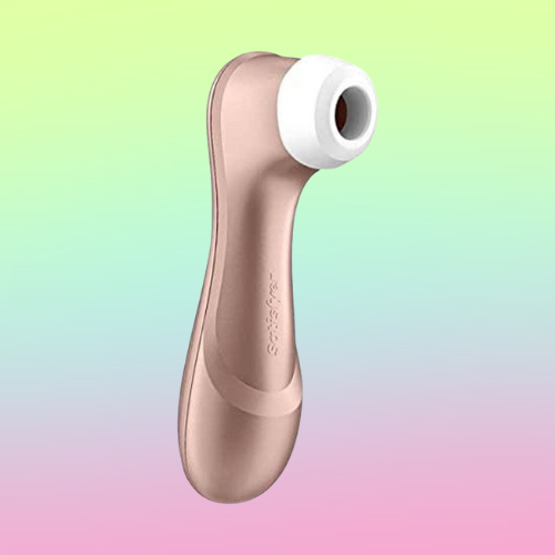 Against a green, blue, and pink ombre background, there is the Satisfyer Pro 2, a rose gold suction toy with a long handle and a white, silicone opening on one end.