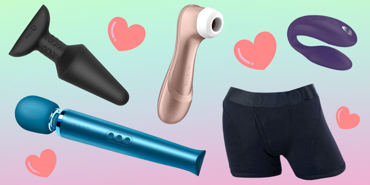 Sex toys and pink hearts are scattered across a green, blue, and pink ombre background. There is a black butt plug, a blue wand vibrator, a rose gold suction toy with a white silicone opening, a black boxer brief harness, and a purple, C-shaped vibrator.