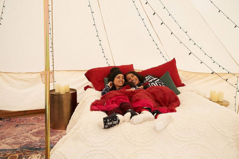 Amanda and her date under a tent