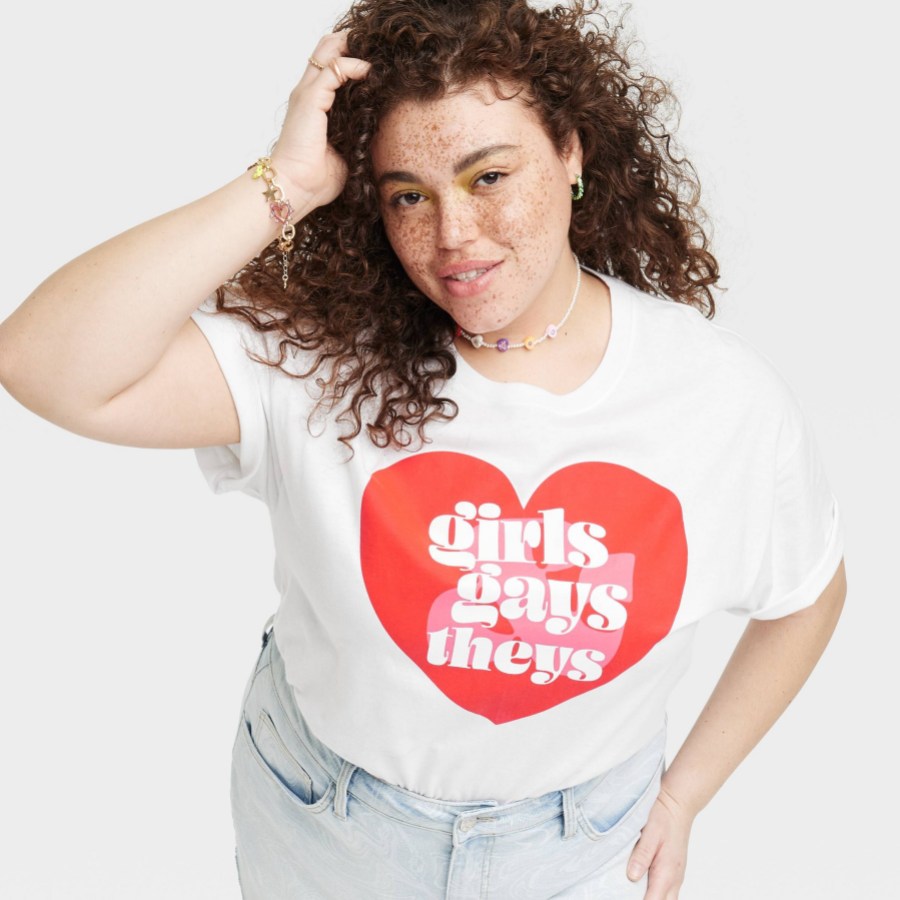 A white shirt with a red heart that reads: girls, gays, they