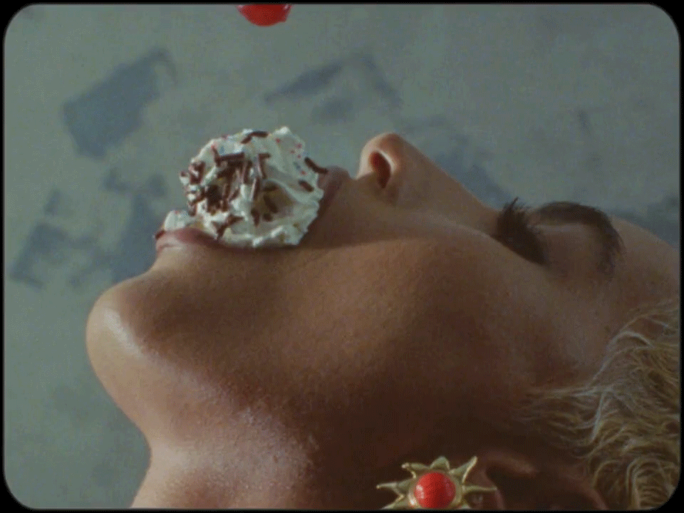An ice cream sundae falls into the mouth of a dancer in Janelle Monáe's new music video.