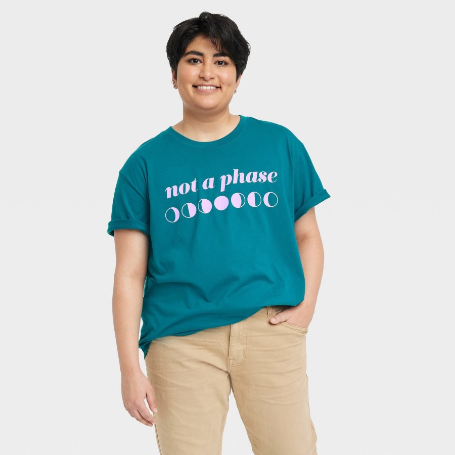target pride 2023 merch drop: a dark aqua shirt that reads "not a phase" with the phases of the moon underneath