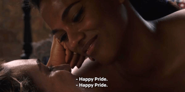 sense8's nomi and amanita in bed saying "happy pride" to each other