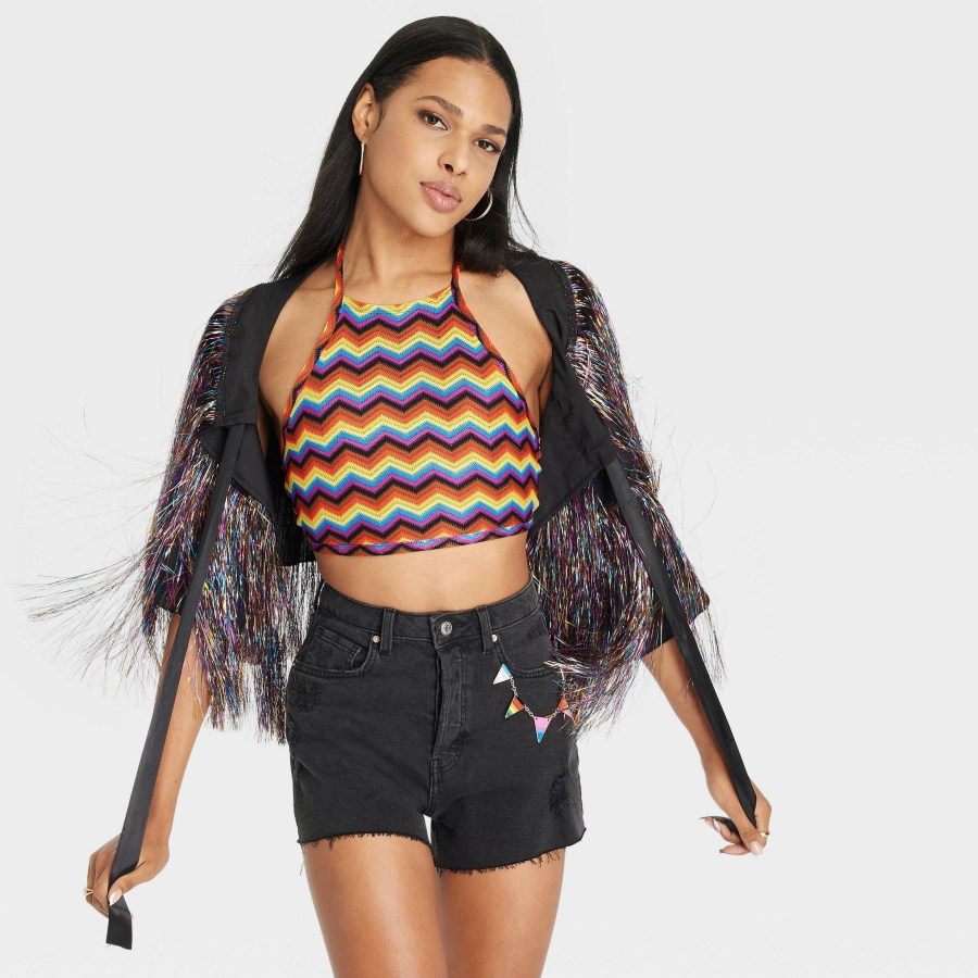 a knitted rainbow crop top and a sparkly shall with lots of strings hanging off of it