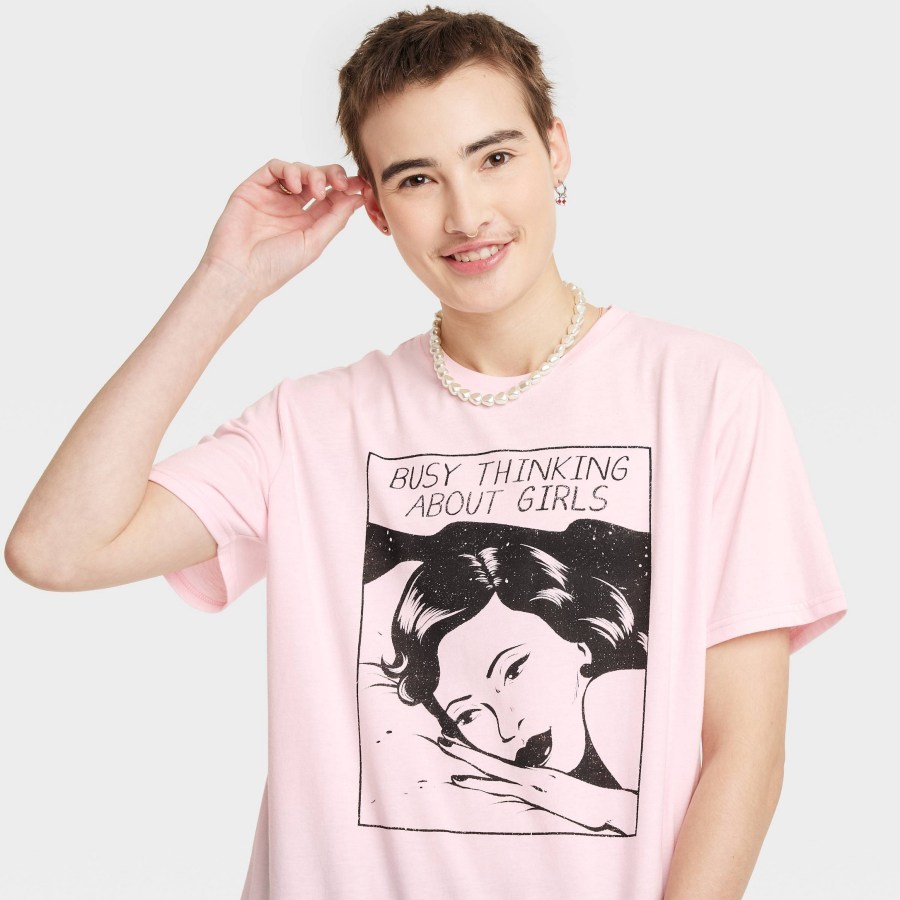 A pink crop top with a Jenifer Prince vintage-style comic book graphic that says "busy thinking about girls"