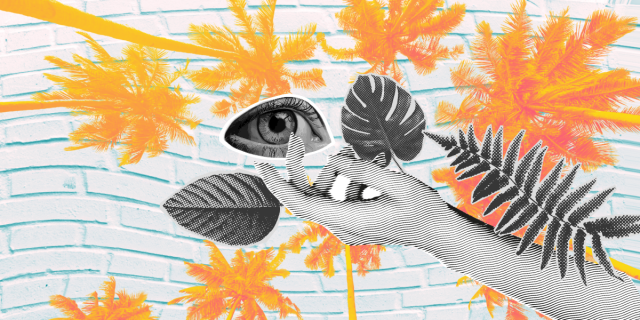 a hand reaching out with an eyeball and three tropical leaves against a layered background of orange and red toned palm trees and a blue brick wall