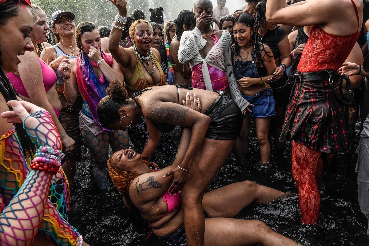 NEW YORK, NEW YORK - JUNE 25: People play in the fountain on June 25, 2023 in Washington Square Park in New York City. Washington Square Park has become a recurrent place for thousands to gather during Pride Day marches on this day. (Photo by Stephanie Keith/Getty Images)