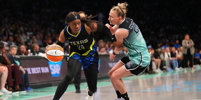 Arike Ogunbowale #24 of the Dallas Wings drives to the basket against Courtney Vandersloot #22 of the New York Liberty at the Barclays Center on June 11, 2023 in the Brooklyn borough of New York City.