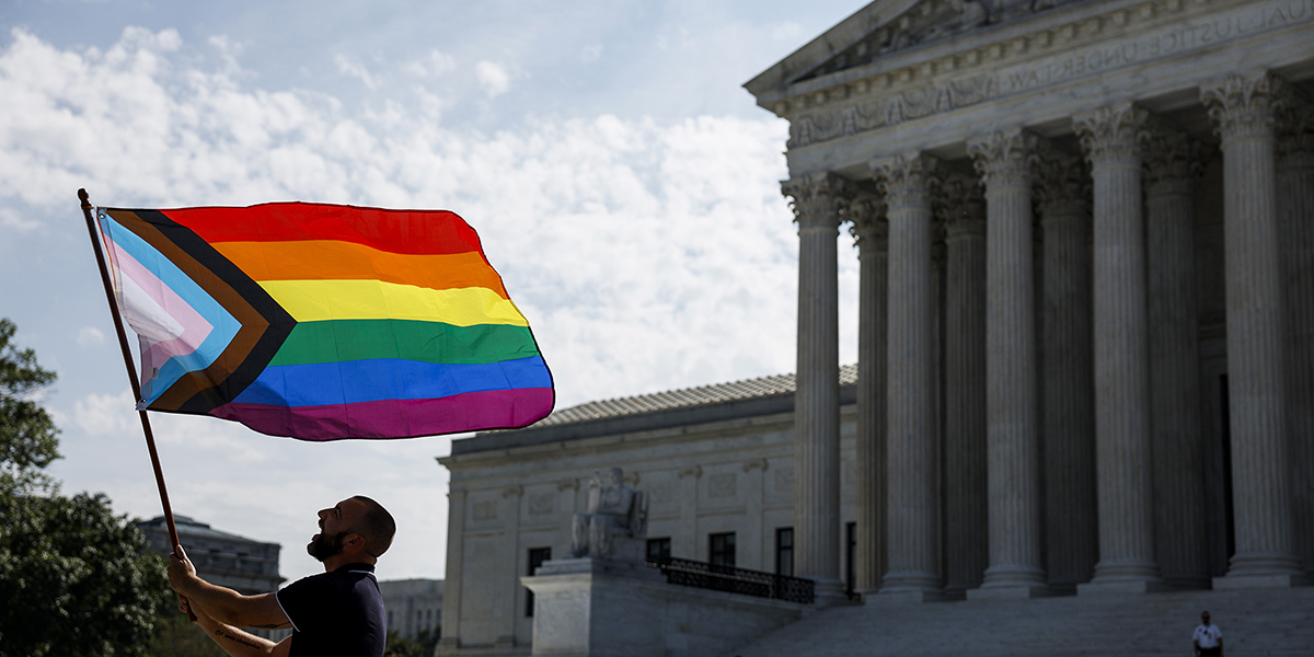 ame-sex marriage supporter Vin Testa, of Washington, DC, waves a LGBTQIA pride flag in front of the U.S. Supreme Court Building as he makes pictures with his friend Donte Gonzalez to celebrate the anniversary of the United States v. Windsor and the Obergefell v. Hodges decisions on June 26, 2023 in Washington, DC. Today marks the 8th anniversary of the Supreme Court's ruling in the Obergefell v. Hodges case that guaranteed the right to marriage for same-sex couples.