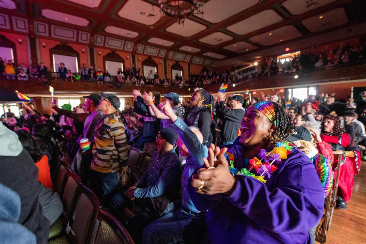 People cheer as they watch entertainers perform on stage during the rally at the Pride Festival in Provincetown, Massachusetts, on June 3, 2023. (Photo by Joseph Prezioso / AFP) (Photo by JOSEPH PREZIOSO/AFP via Getty Images)