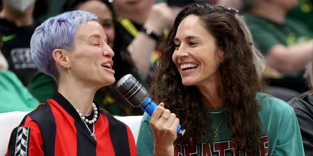Megan Rapinoe and partner Sue Bird lip sync to "I Want It That Way" by the Backstreet Boys during a timeout in the second quarter between the Seattle Storm and the Los Angeles Sparks at Climate Pledge Arena on June 06, 2023