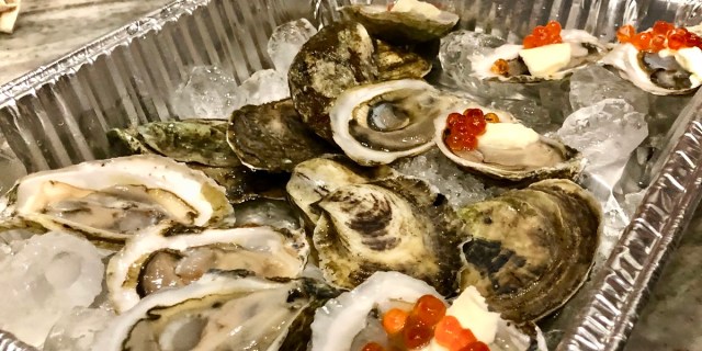 oysters topped with salmon roe and creme fraiche