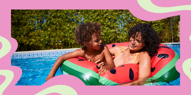 a Black mom and her son in a watermelon float in the pool