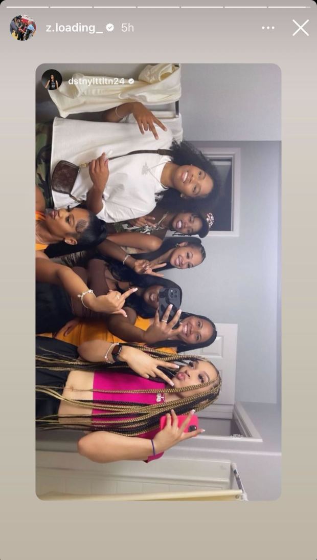 An Instagram Story of a variety of young Black girls in their early 20s, all piled together in a bathroom mirror.