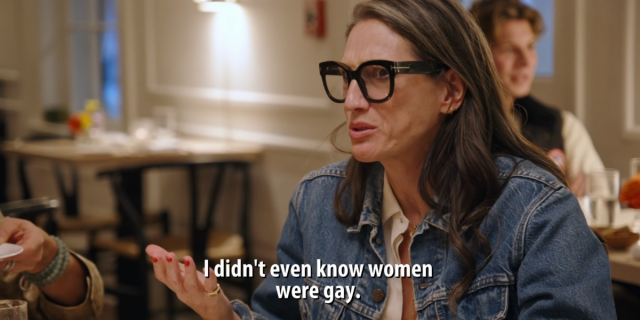 Jenna Lyons in a jean jacket and thick framed glasses saying "I didn't even know women were gay"