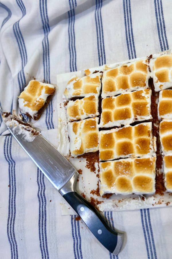 S'mores brownies, being cut into with a very large knife