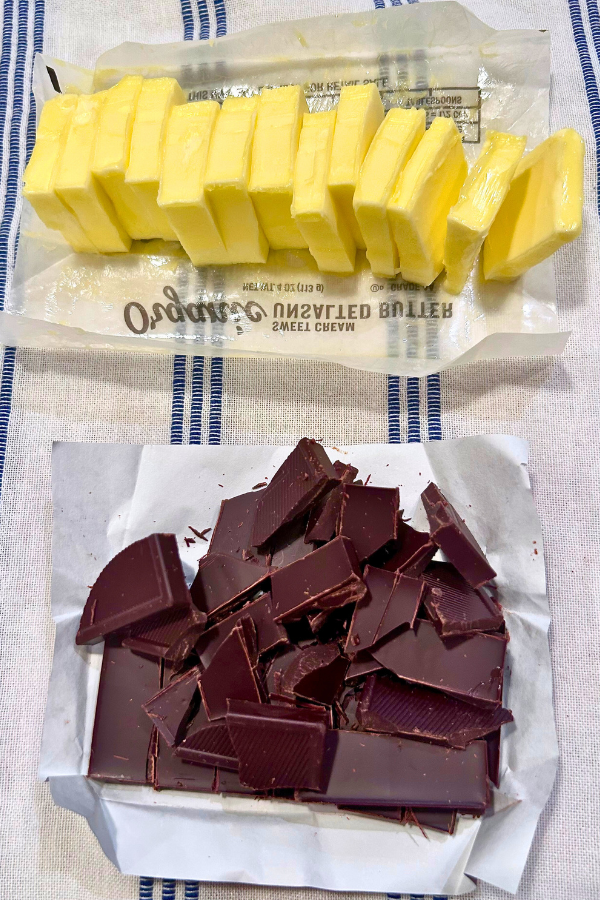 Cut up butter on top of cut up dark chocolate