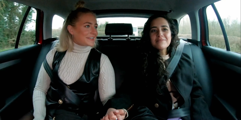 Dempsey and Statler holding hands in a car
