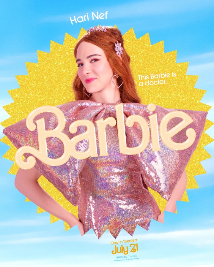 Hari Nef as Doctor Barbie (she has on a sparkly pink dress with a large bow in front)
