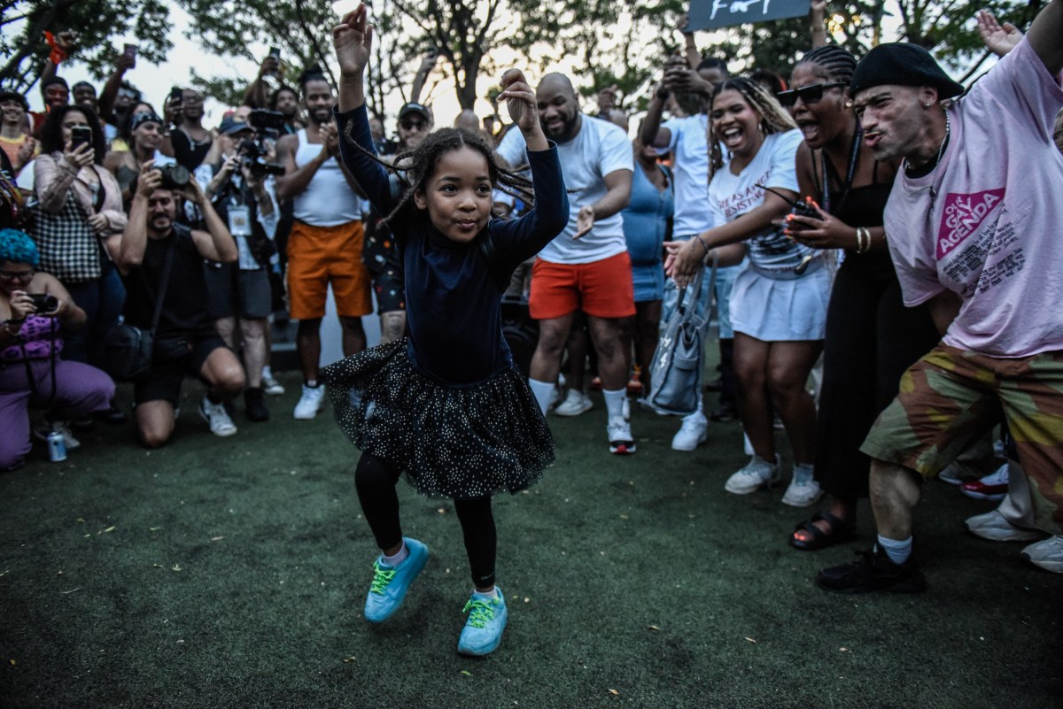 NEW YORK, NEW YORK - AUGUST 5: A child dances after a memorial march for O'Shae Sibley on August 5, 2023 in New York City. O'Shae Sibley was stabbed to death at a gas station in Brooklyn on July 29th after being seen dancing in the parking lot.