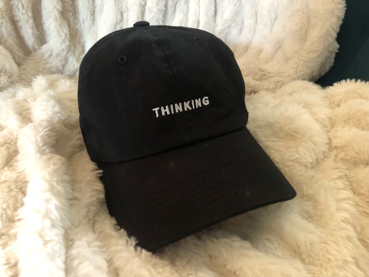 a black hat that says THINKING