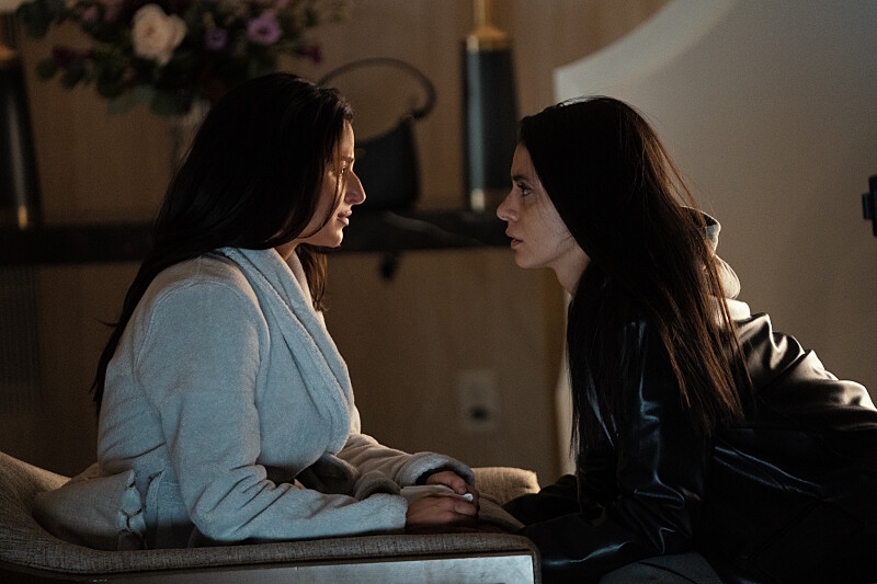 After a night of passion leaves them with more questions than answers, Aaliyah (on the left, in a hotel robe) holds hands with Cruz (on the right in a leather jacket and hoodie) and they plot a way forward.
