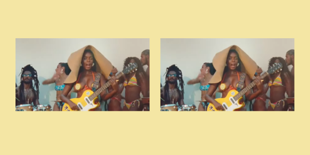 Janelle Monáe playing guitar in the WATER SLIDE music video