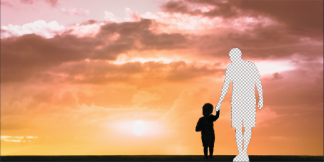 against a sunset background, a sillhouetted father holds the hand of a kid. The father's figure is deleted, replaced with the photoshop blank background pattern